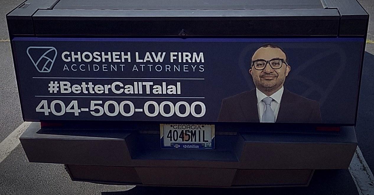 Cybertruck tailgate wrap with GHOSHEH LAW FIRM, #BetterCallTalal and 404-500-0000